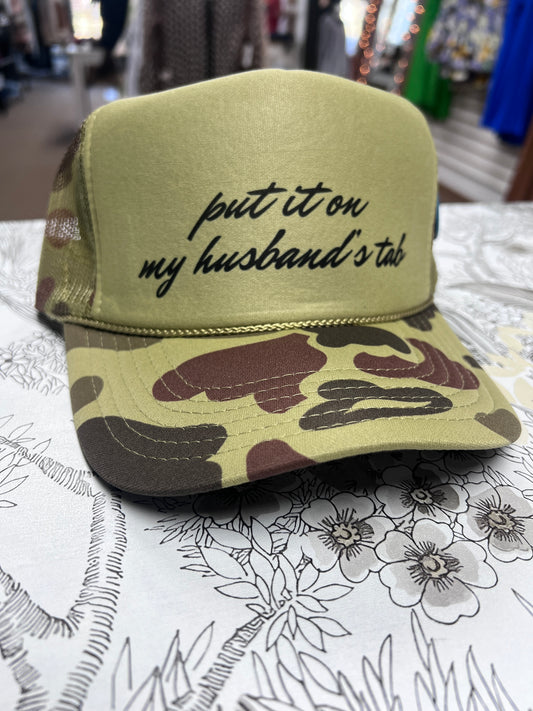 Put It On My Husband’s Tab Trucker Hat